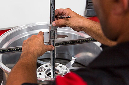 Vossen wheel quality control inspection being undertaken by an employee